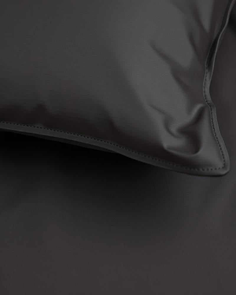 Close-up charcoal grey sateen pillowcase detail