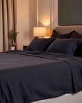 Sateen Bed Sheet Set in Charcoal Grey on bed