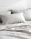 Sateen Pillowcase Set in Mist Grey on bed